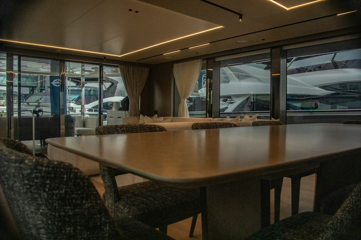 Intimate VIP salon with a single casino-themed table, low lighting and brass detailing